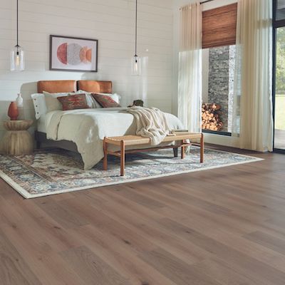 wood look laminate flooring in a bright Baton Rouge bedroom